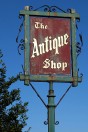 an antique shop sign