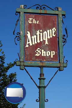an antique shop sign - with South Dakota icon